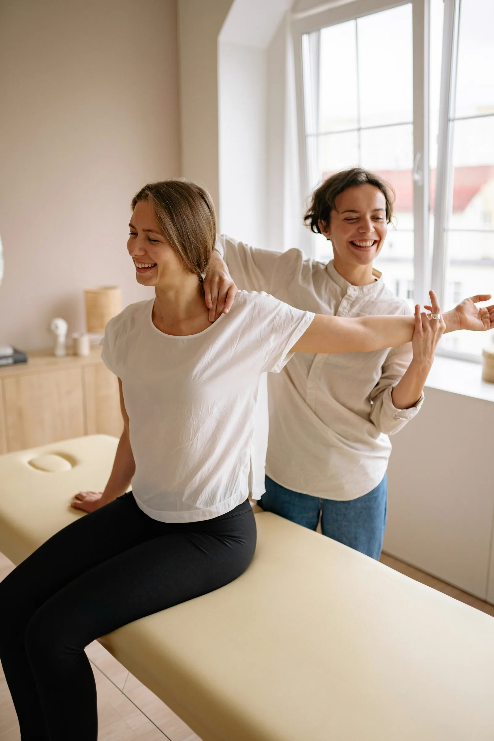 Patient and therapist talking during a rehabilitation appointment.